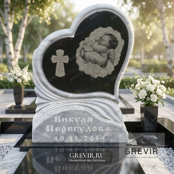 Памятник из гранита с изображением ангела и креста